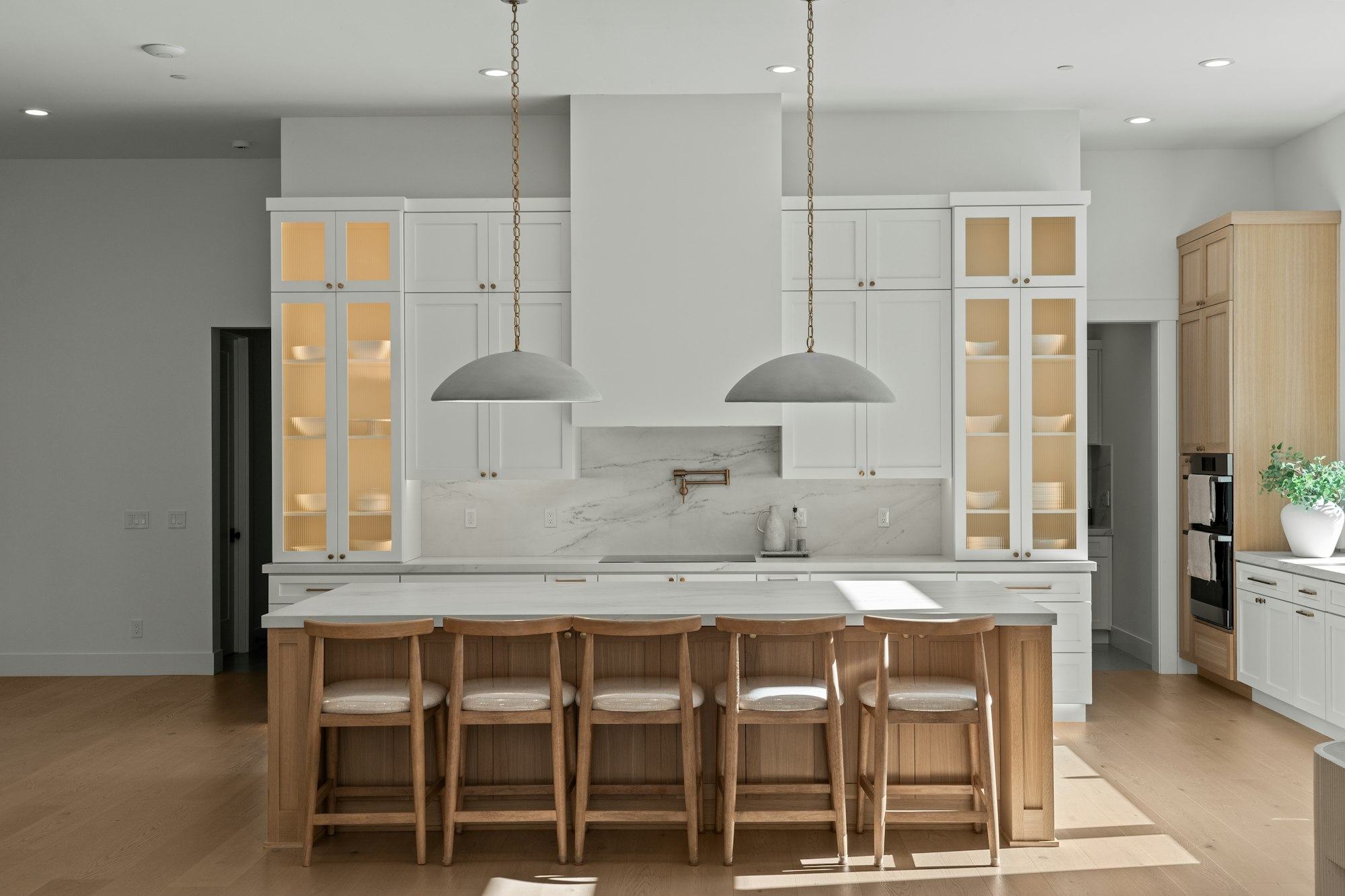 Kitchen with light cabinets and a wood island