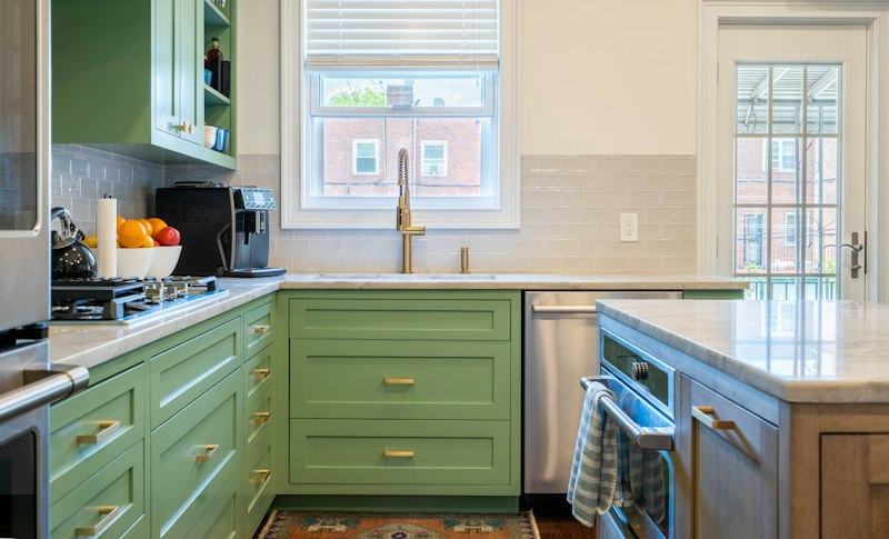 Kitchen with green cabinets