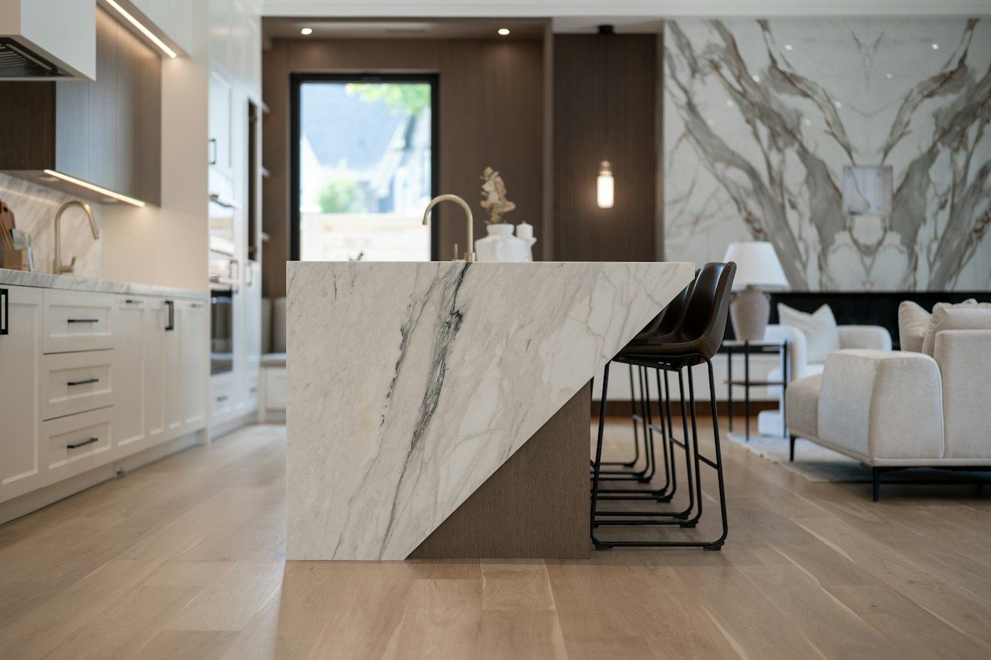 Kitchen with a marble waterfall island