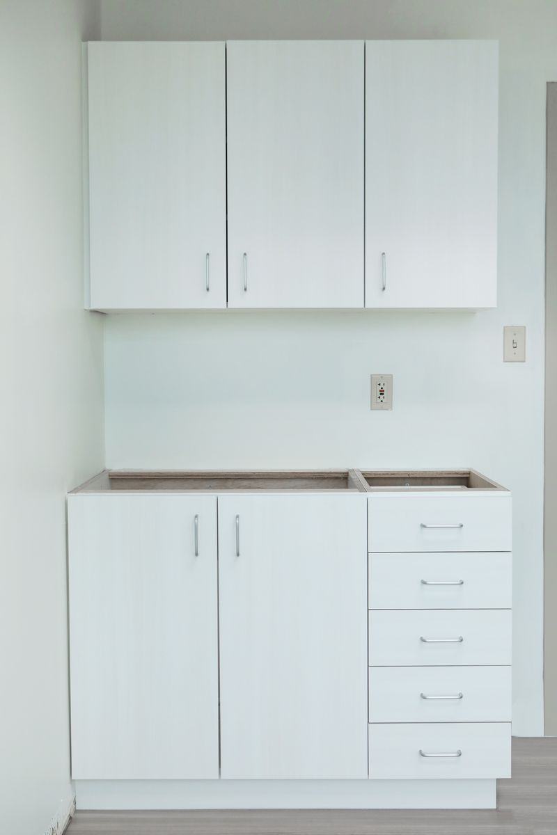 White cabinets after wrapping in architectural film
