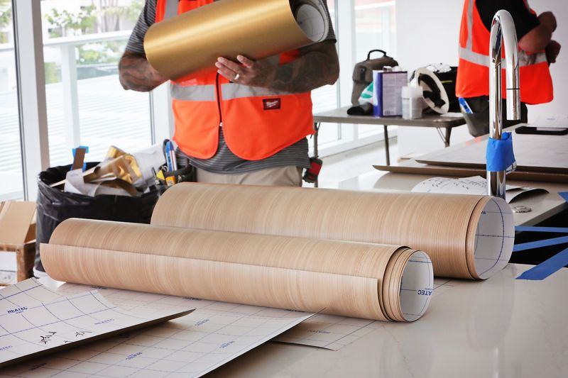 Rolls of woodgrain and metallic architectural film