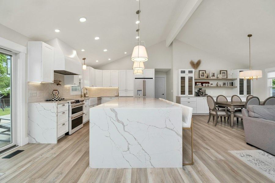 Finished bright kitchen with a marble island